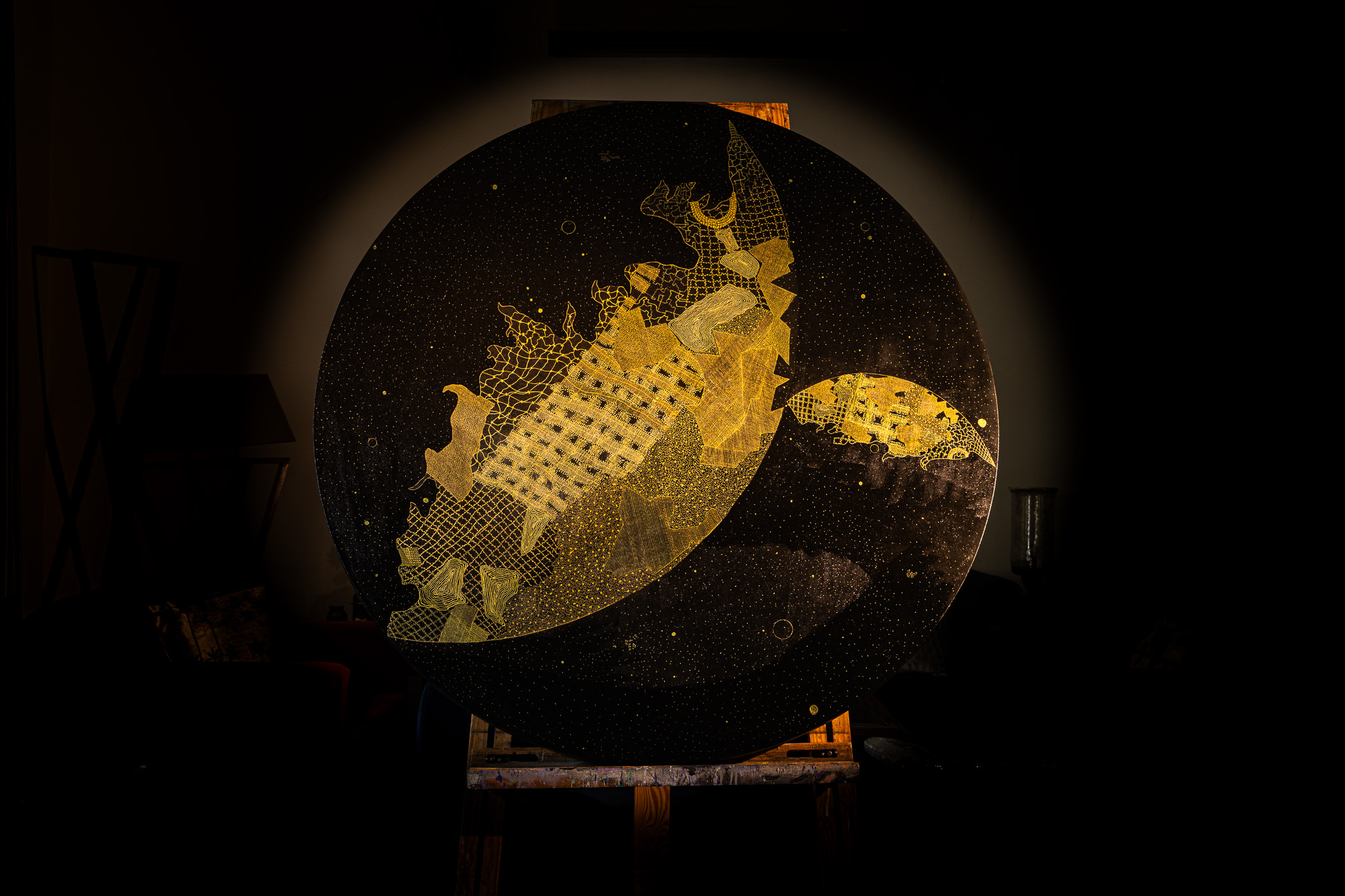 Gold and black circular work — full view